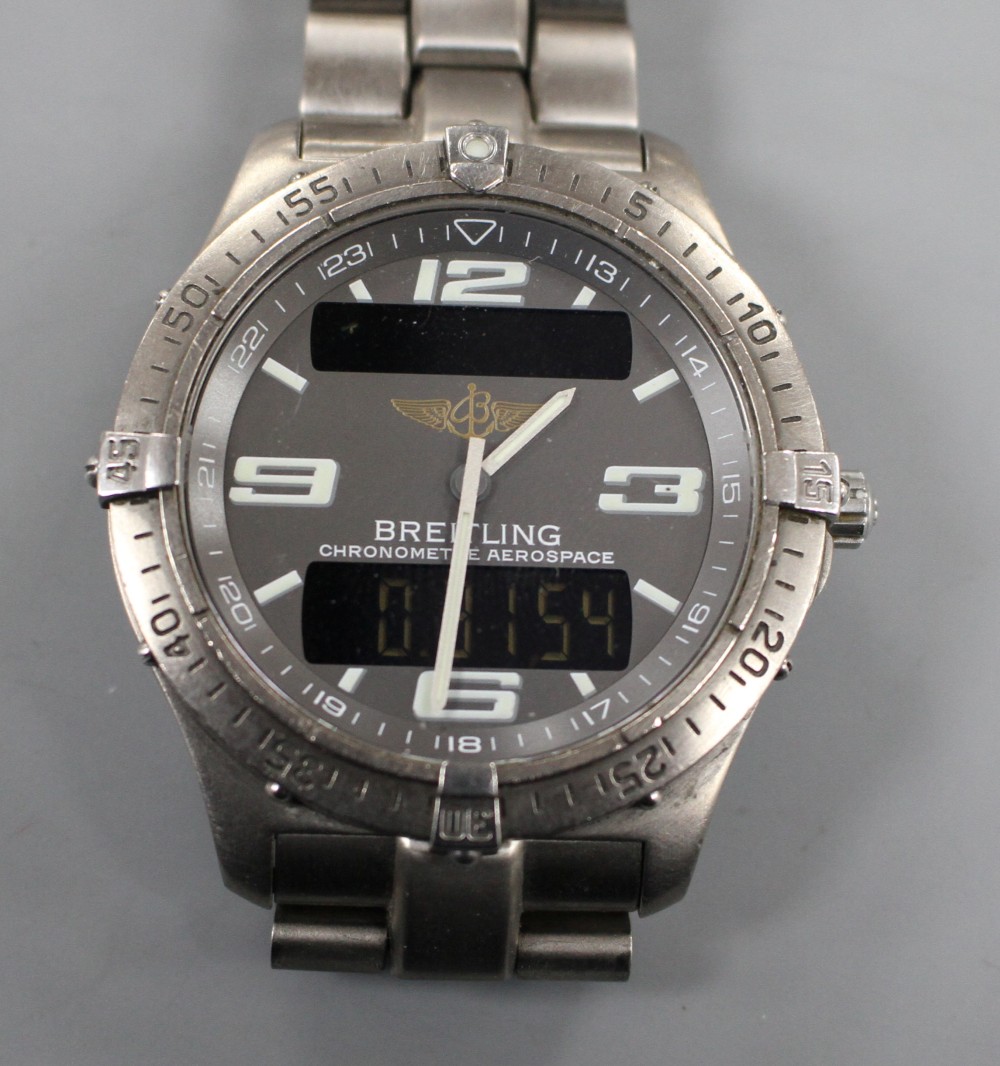 A gentlemans steel Breitling Aerospace quartz wrist watch, on Breitling bracelet.